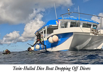 Twin-Hulled Dive Boat Dropping Off Divers